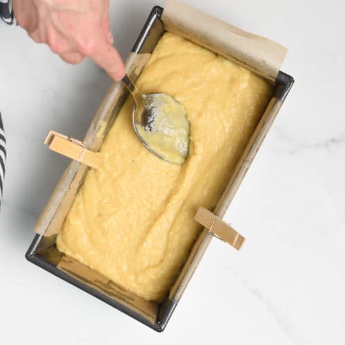 Pouring the Almond Flour Pound Cake batter into a pan.