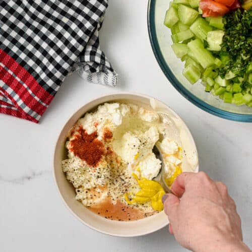 Making the Cottage Cheese Salad dressing in a small bowl.