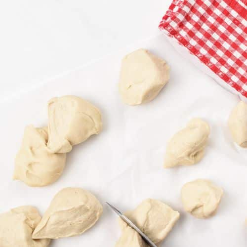 Slicing the 2-Ingredient Tortilla dough ball.