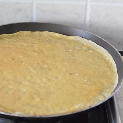 Almond Flour Crepe cooking on a pan.