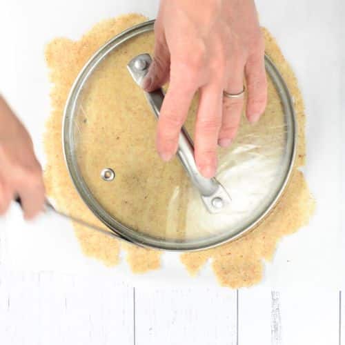 Cutting the Almond Flour Tortillas into a round shape with a lid.