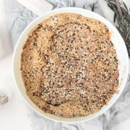 Adding wet ingredients to the Flaxseed Cracker dough.