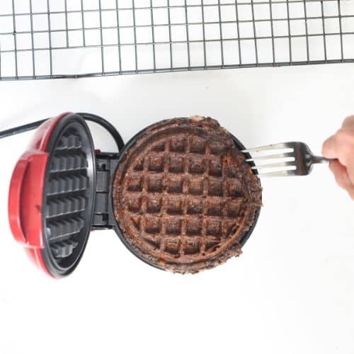 Taking Keto Chocolate Chaffles out of a waffle iron.