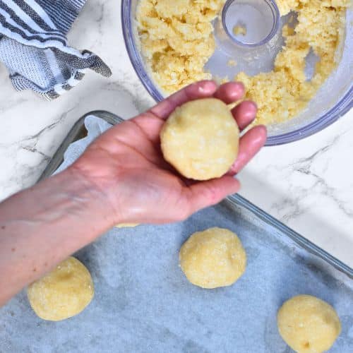 Rolled ball of Keto Coconut Cookie dough.