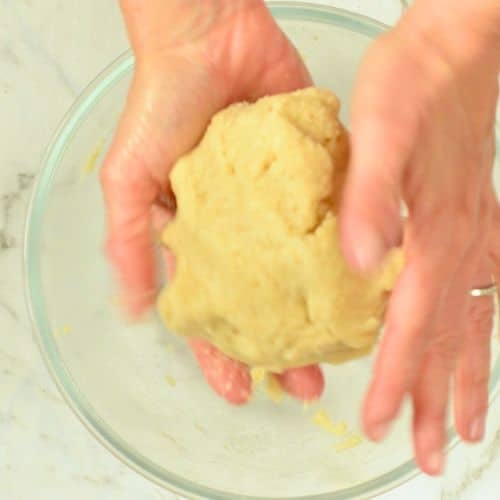 Ball of Keto Snickerdoodle Cookie dough in my hands.