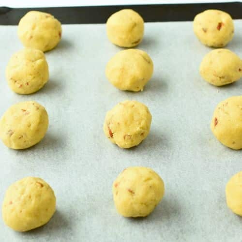 Keto Snowball Cookies on a baking sheet ready to bake.