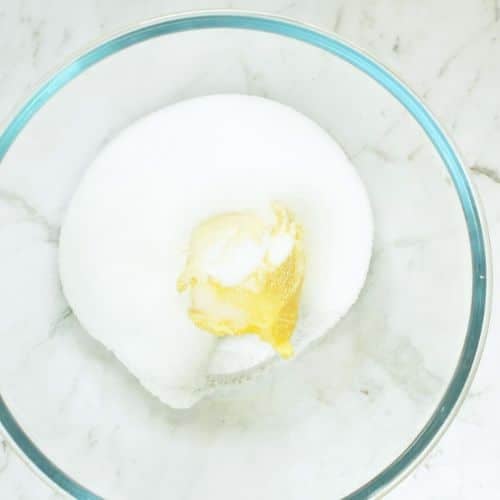 Powdered sweetener and butter in a mixing bowl.