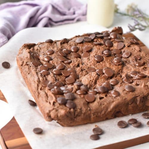 Protein Brownies cooling on a wooden board.