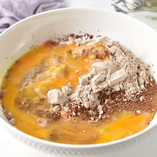 Ingredients for Protein Brownies in a large mixing bowl.