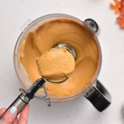 Ice cream scoop with a dollop of Protein Pumpkin Muffin batter.